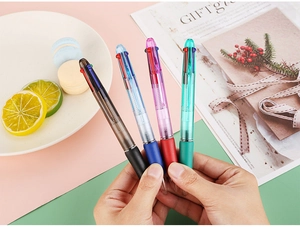 Detail of four-color ballpoint pen with ergonomic soft rubber grip and translucent body