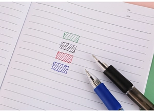 Detail view of 4-color retractable ballpoint pens with multi-color ink ink writing samples