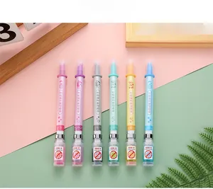 Detail view of 6 creative syringe shaped pens with COVID-19 vaccine theme designs