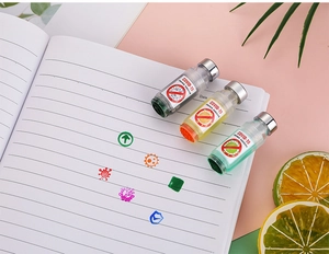 Macro detail of vaccine-style roller stamps creating medical patterns on paper