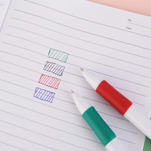 Creative 4-color ballpoint pen with rubber grip for office writing on a notebook