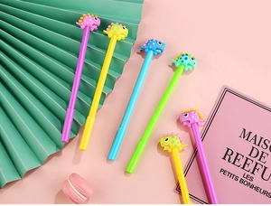 Detail of creative dinosaur pens with cute 3D silicone caps in vibrant pastel colors