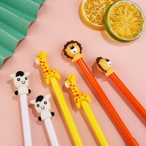 Detailed view of cartoon lion, giraffe, and cow gel pens with silicone animal toppers
