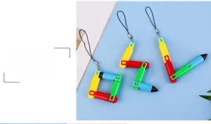 Macro detail of foldable puzzle ballpoint pen with colorful rotating sections and lanyard