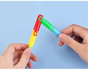 Macro detail of flexible colorful folding ballpoint pen with multi-angle joints