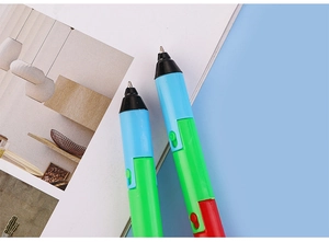 Detail of multi-color folding ballpoint pens with a metal tip and lanyard design