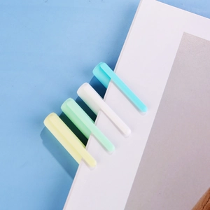 Morandi color gel pen set on notebook edge with a minimalist aesthetic style