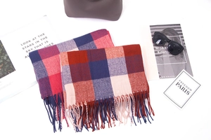 Flat lay view of checkered cashmere-feel scarves with tassels and fashion accessories