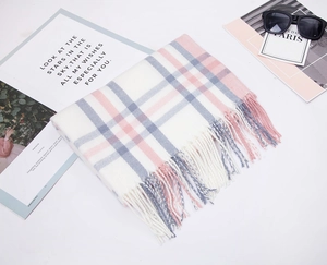 Detail of pink and grey plaid scarf with soft fringes and stylish fashion accessories
