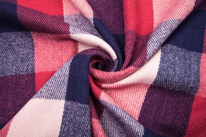Detail of red and blue checkered pashmina scarf with premium twill weave texture