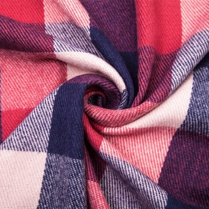 Soft red and navy plaid cashmere-feel shawl with elegant spiral folding detail