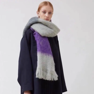 Close-up detail of soft faux mohair scarf with grey and purple gradient stripe pattern
