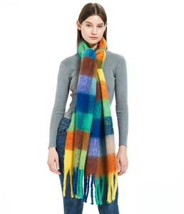 Detailed view of soft rainbow plaid mohair scarf with thick texture and long tassels
