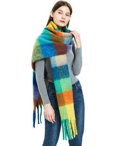 Detail of soft mohair texture and colorful rainbow plaid pattern on thick fringed scarf