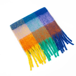 Close-up of rainbow checkered mohair scarf with thick texture and long tassels