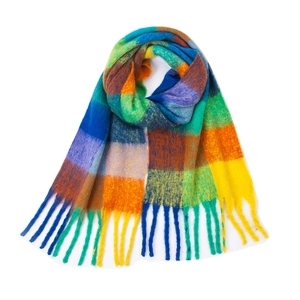 Close-up of vibrant rainbow checkered scarf with long fringe and thick soft texture