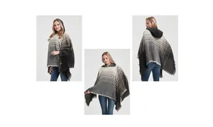 Detail view of women's hooded poncho with herringbone pattern and fringe trim finish