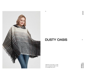 Detail view of herringbone knit poncho with fringe edges and hood for women