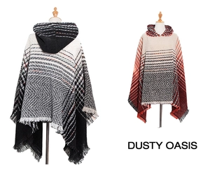 Detail of hooded knit ponchos with herringbone patterns and decorative fringe hem