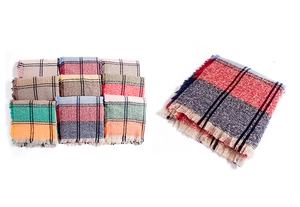 Detailed view of the soft plaid pattern and fine fringe edges on the thick woven scarf
