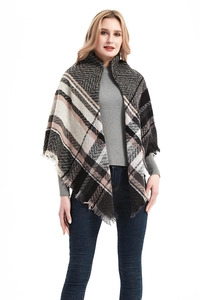 Detail of herringbone triangle shawl with black pink check pattern and fringe trim