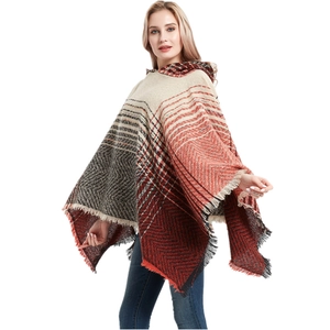 Women's hooded poncho with herringbone gradient pattern and fringe tassels in knit fabric