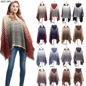 Women's hooded knit poncho with herringbone pattern and fringe trim in 8 gradient colors