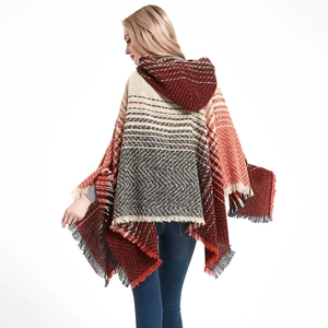 Women's hooded knit poncho with red geometric plaid pattern and fringe hem details