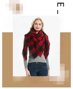 Detailed view of soft cashmere-feel red and black buffalo check scarf with tassels