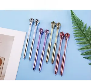 Detail of four crystal crown ballpoint pens in silver, purple, gold and rose gold