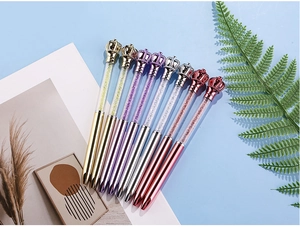 Close-up of crown crystal ballpoint pens in vibrant colors arranged in a stylish fan shape