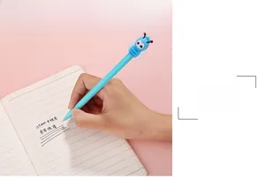 Detailed view of hand writing with 0.5mm cute blue bee cartoon gel pen on notebook