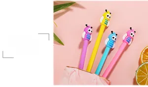 Close-up of cute bee-shaped gel pens in purple, yellow, blue, and pink colors