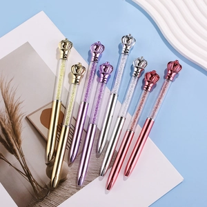 Elegant crystal crown ballpoint pens with metallic finish in gold, purple and silver