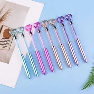 Set of 8 heart-topped crystal ballpoint pens in various pastel colors on a blue background