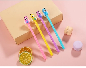 Detail of four colorful bee-topped gel pens in pink yellow purple and blue colors