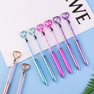 Detail view of colorful crystal ballpoint pens with heart-shaped diamond tops in 8 colors
