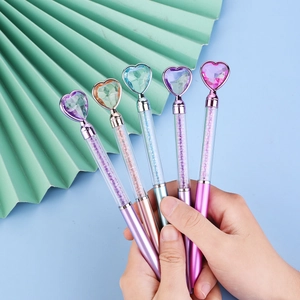 Five colorful heart-topped crystal pens with liquid sand glitter in metal-like barrels