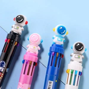 Close-up of four astronaut multi-color pens with 3D cartoon toppers on a blue background