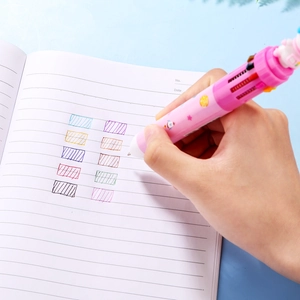 Pink astronaut 10-color ballpoint pen demonstrating smooth writing on a notebook
