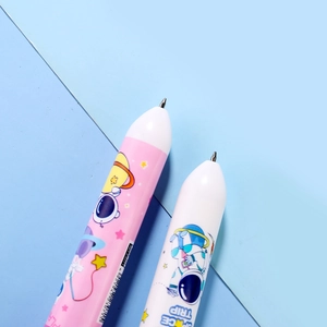 Detail of pink and white astronaut multi-color pens with decorative space illustrations