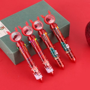Close-up of 4-pack Christmas 10-color pens with glitter reindeer topper and festive icons