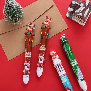 Close-up of 10-color Christmas ballpoint pens with cartoon silicone toppers and festive patterns