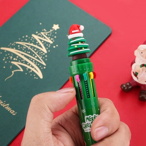 Detail of Christmas tree pen tip and multi-color ink selector on green festive body