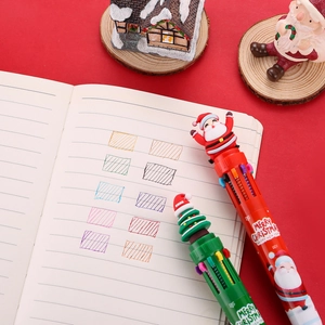 Detailed view of Christmas multi-color pens showing ten ink strokes and festive props