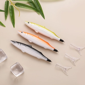 Detailed view of fish-shaped creative ballpoint pens in yellow, orange, and black colors