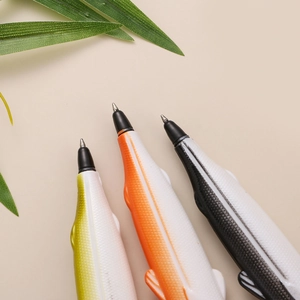 Detail of fish-shaped creative pens with realistic scale textures and metal pen tips