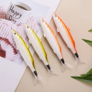 Detailed close-up of four realistic fish-shaped creative ballpoint pens on a desktop