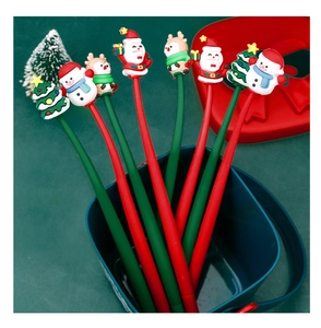 Close-up of Christmas gel pens featuring Santa, snowman and reindeer toppers in a blue cup