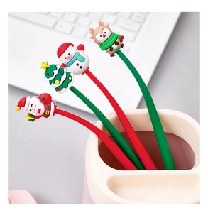 Close-up of Christmas silicone pens featuring Santa, snowman, and reindeer toppers